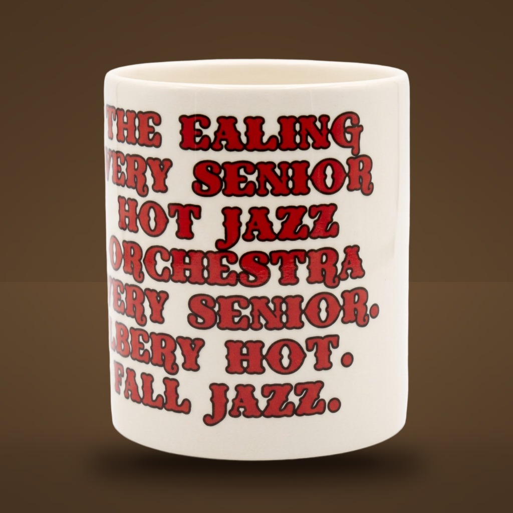 Ceramic mug printed with The Ealing Very Senior Hot Jazz Orchestra in red lettering.